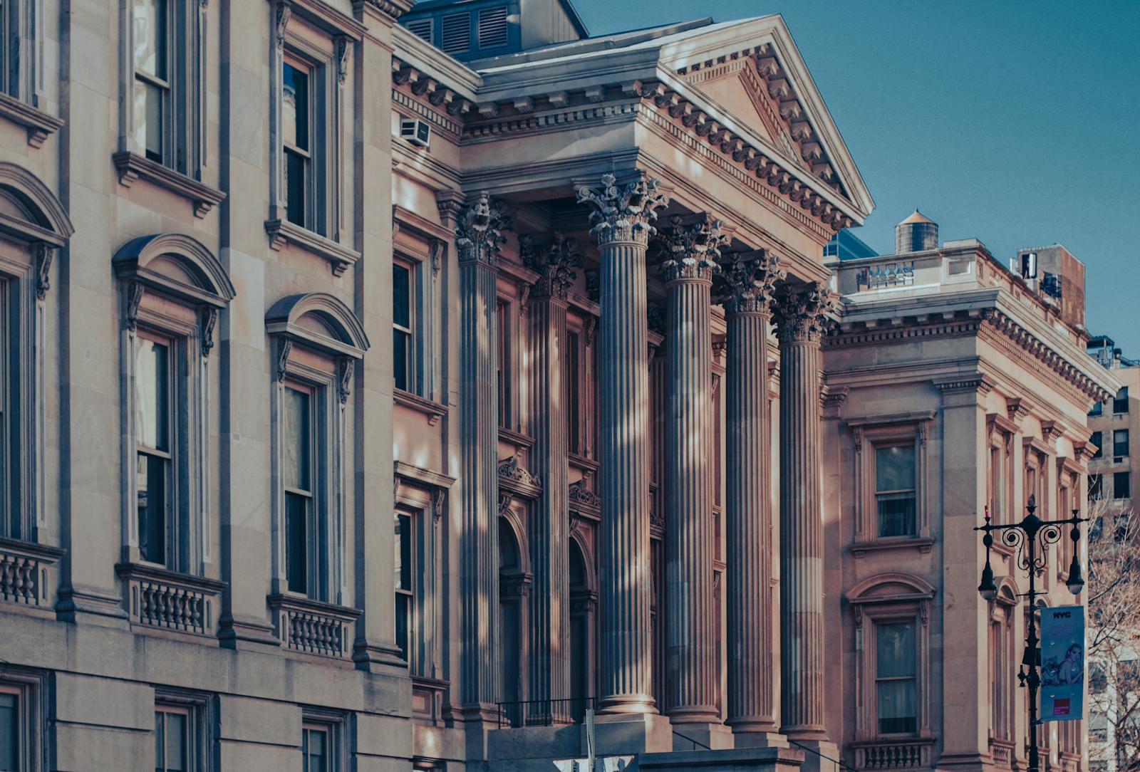 Neoclassical architecture of Tweed Courthouse in Manhattan at dusk capturing urban elegance.